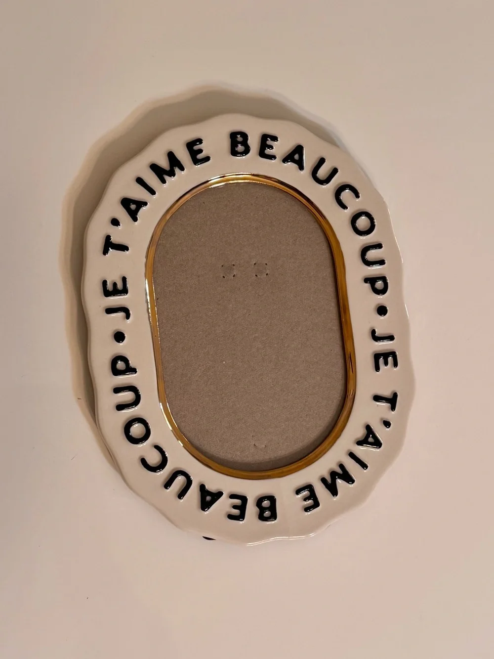 Anthropologie White Ceramic Oval Frame with Black Script and Gold Trim